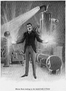 Tesla holding balls of electricity.